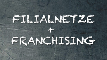 Filialnetze + Franchising auf dunklen Hintergrund